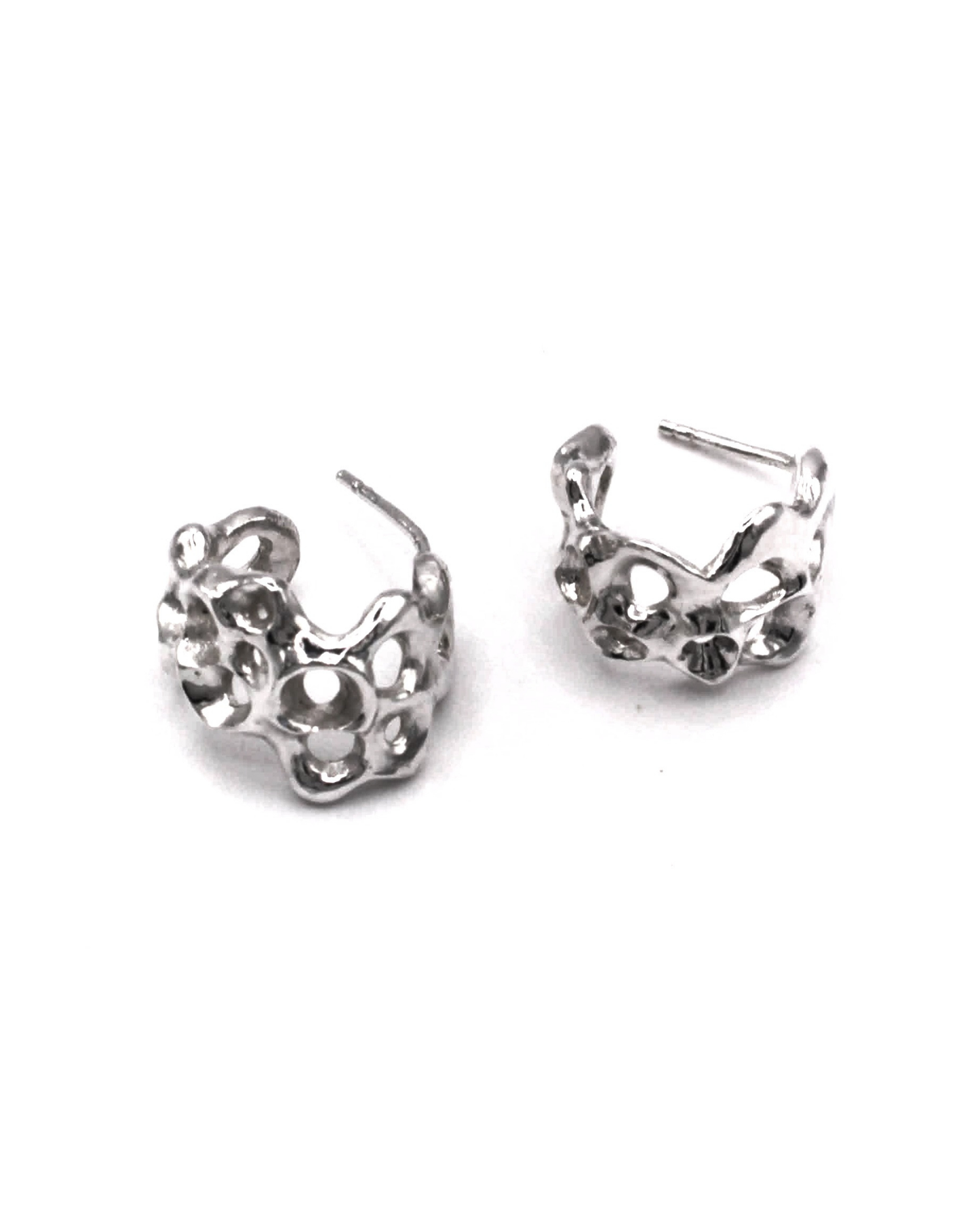 A pair of silver-toned textured hoop earrings with organic, bubble-like openwork details, displayed on a clean white background.