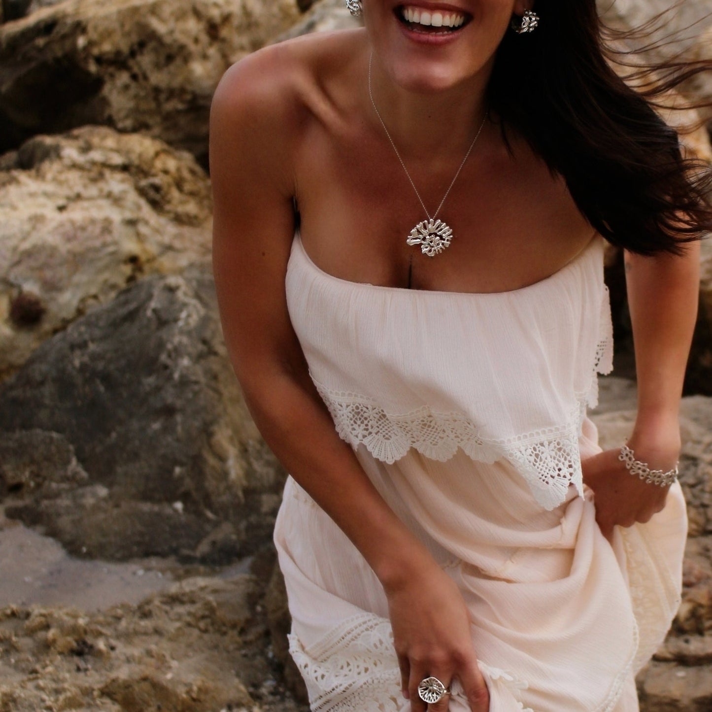 Artisan sterling silver necklace inspired by shells and ocean forms styled for everyday wear