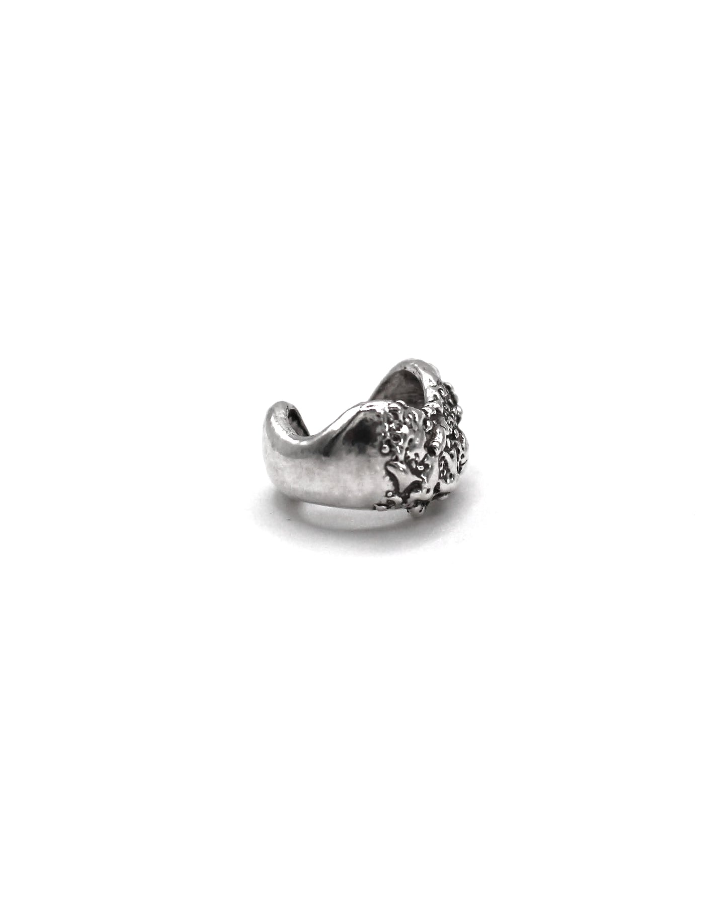 Front view of the Piedra Sorra sterling silver ear cuff with organic coastal-inspired texture on a white background.