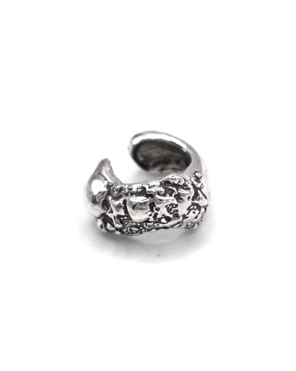 Minimalist sterling silver ear cuff handmade in Valencia, inspired by Mediterranean coastal stones and natural textures.