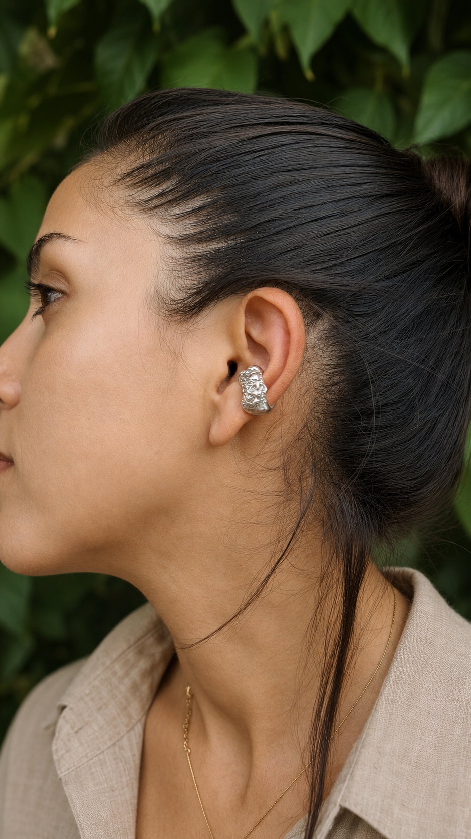 Model wearing the Piedra Sorra sterling silver ear cuff inspired by Mediterranean sea-worn stones. No piercing required.