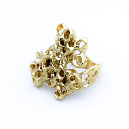 Gold plated statement ring with barnacle inspired sculptural design, meaningful artisan jewelry