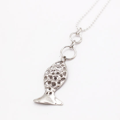 Sterling silver fish pendant, handcrafted using the lost wax casting technique. Unique Mediterranean-inspired jewelry, perfect for ocean lovers and sustainable fashion enthusiasts. Ethical and nature-inspired design, capturing the beauty of marine life in recycled silver