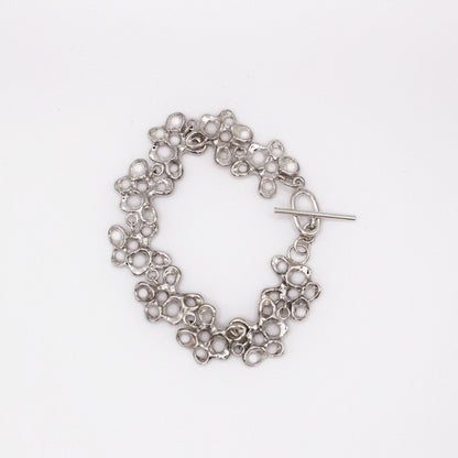 Statement silver bracelet inspired by Mediterranean sea life, artisan symbolic jewelry